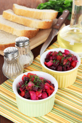 Beet salad in bowls on table close-up