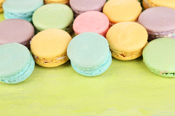 Gentle macaroons on wooden table close-up