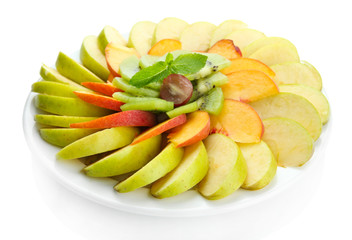 Naklejka na ściany i meble Assortment of sliced fruits on plate, isolated on white