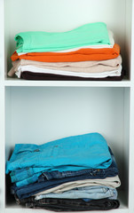 Clothes neatly folded on shelves