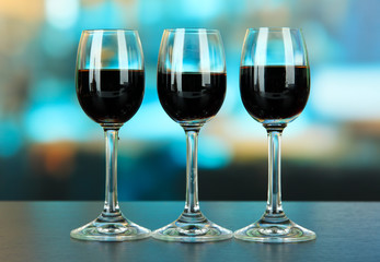 Glasses of liquor,  on bright background