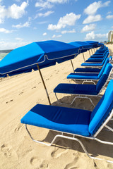 umbrellas and empty beach couches at the beach