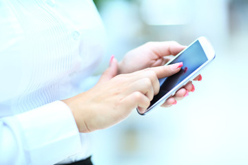 Close-up Of Woman's Hand Using Cell Phone