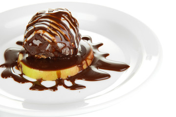Chocolate dessert on big plate close up