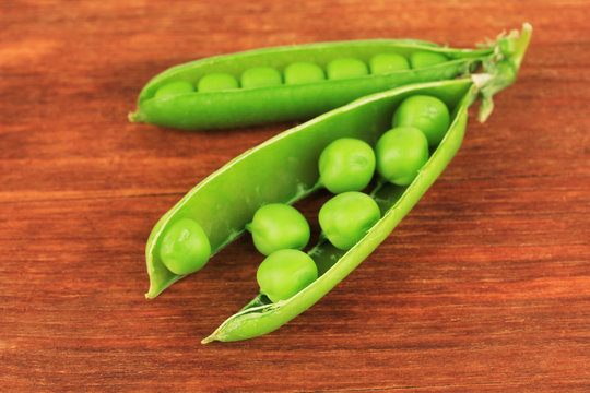 Sweet green peas on wooden background