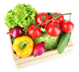 Fresh vegetables in wooden box on white background