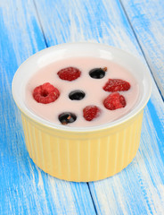 Delicious yogurt with fruit on table close-up