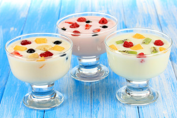 Delicious yogurt with fruit on table close-up