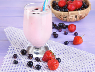 Delicious milk shake with blackberry and strawberries
