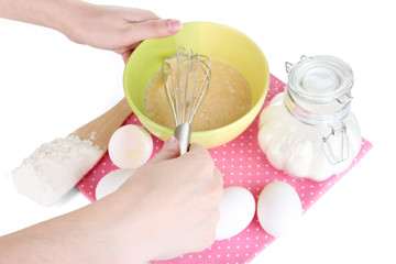 Whisking eggs isolated on white