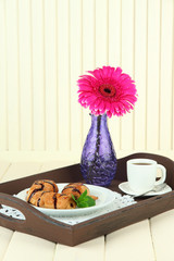 Wooden tray with breakfast,
