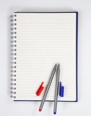 notebook and pen on white background