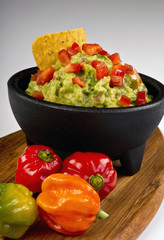 Guacamole and spicy peppers.
