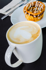 Latte on the black table