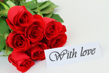 With love card and red roses bouquet