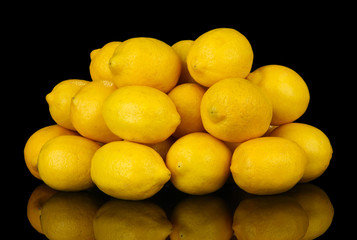 Ripe lemons isolated on black