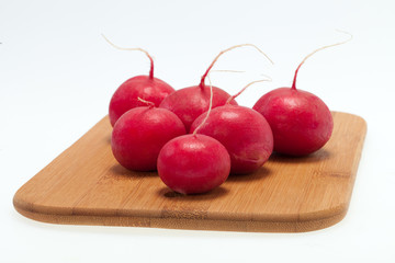 Garden radish on wooden board
