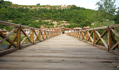 Fototapeta premium Wooden bridge through Yantr Veliko Tyrnovo's river, Bulgaria