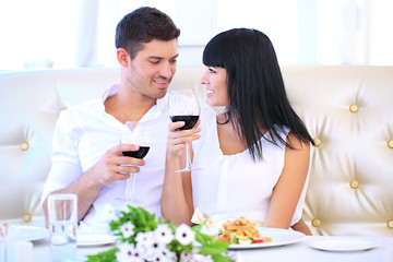 Beautiful couple having  romantic dinner at restaurant