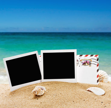 photo frame and a letter from vacation in the sand