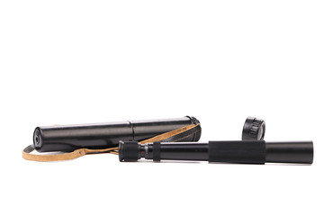 Black cover and spyglass lying