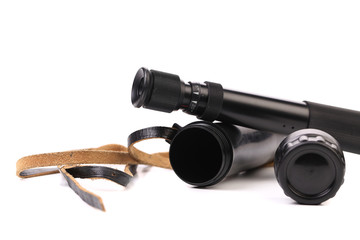 Black cover and spyglass lying