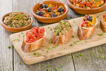 Tapas on Crusty Bread - Spanish tapas on a sliced baguette