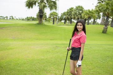 Girl golf player at green