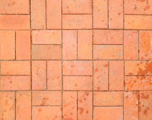 Red brick paving stones on a sidewalk