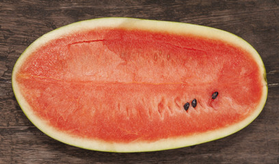 Watermelon fruit on the old wood background