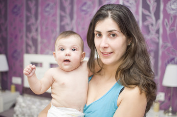 Mother and baby in home bedroom