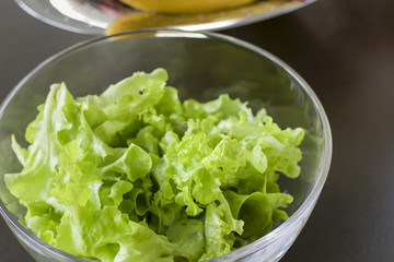 glass bowl of green salad leafs