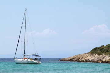 sailing boat anchored in a bay