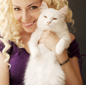 Beautiful girl holding Persian cat
