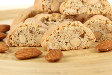 Aromatic cookies cantuccini on wooden plate close-up