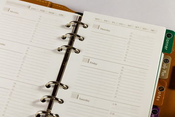 Close up image of black note book organizer against white backgr