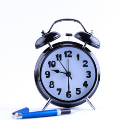 Alarm Clock  with pen closeup