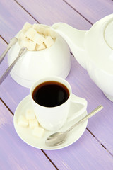 Cup of coffee, on color wooden background