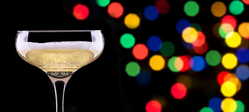 glass of champagne isolated on party background