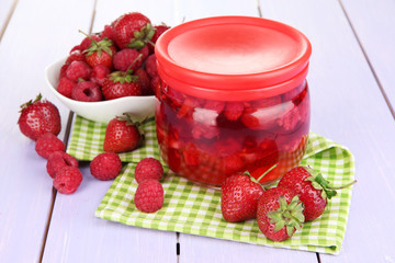 Home made berry jam on wooden table
