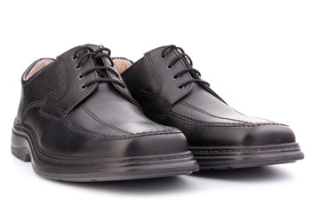 Black glossy man’s shoes with shoelaces