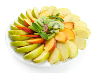 Fototapeta na wymiar Assortment of sliced fruits on plate, isolated on white
