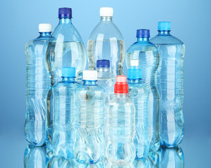 Bottles of water, on blue background