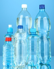 Bottles of water, on blue background