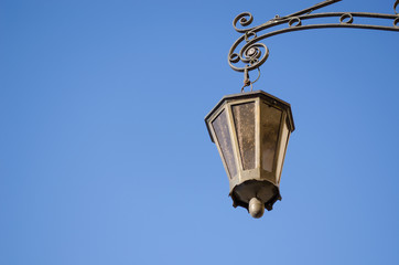 Fototapeta na wymiar retro iron light lamp background dark blue sky