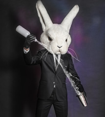 man in hare mask . black suit barman on gray background - 54867612
