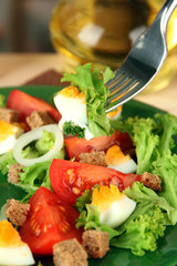 Fresh mixed salad with eggs, tomato, salad leaves and other