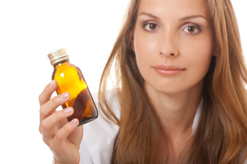 Fototapeta premium woman doctor with medication in glass bottles