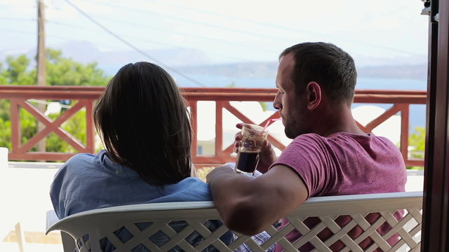 Couple in love talking and relaxing on beautiful terrace