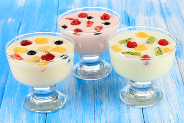 Delicious yogurt with fruit on table close-up